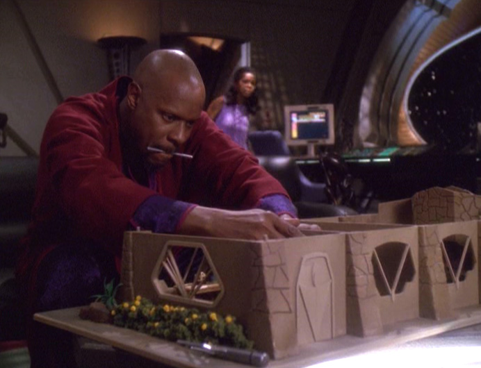 This miniature house needs a miniature clock... right... there.